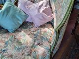 a couch that has a lot of pillows on top of it