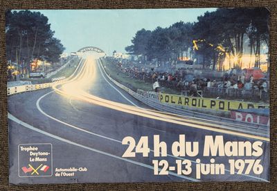 a poster with a picture of a race track with cars going down it