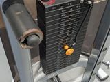 a close up of a gym machine with a pull up bar