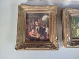 two framed paintings of a family with a child and a dog