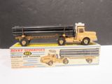 a toy truck with a large pipe attached to it ' s back