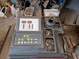 a machine that is sitting on a pallet in a garage