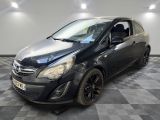 a picture of a black car parked in a garage