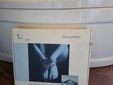 a box that is sitting on the floor next to a bath tub