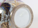 a close up of a vase with a flower design on it