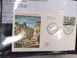 a picture of a postcard with a picture of a mountain village on it