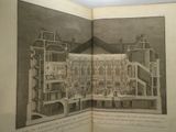 an open book with a drawing of a building inside of it
