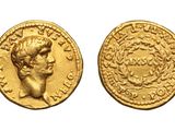 a gold coin with a head of a man on it
