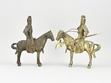 pair of bronze figurines of a man on a horse and a man on a horse