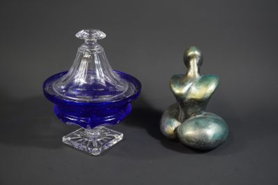 two glass vases sitting next to each other on a table