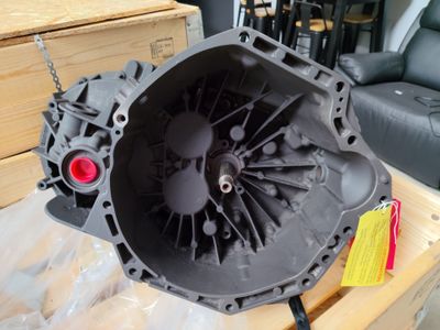 an image of a car engine sitting on top of a wooden table