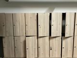 a lot of wooden lockers in a room