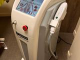 a machine that is sitting on the floor next to a bed