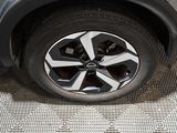 a close up of a tire on a car ' s rim