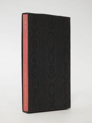 a black book with a red stripe on the cover