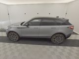an image of a grey land rover parked in a garage