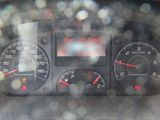 a close up of the dashboard of a car in the rain