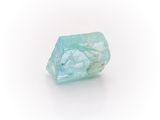 an image of a piece of aqua colored rock on a white surface