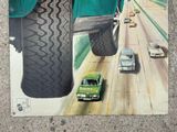 a picture of a painting of a green car on the road