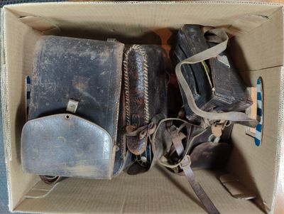 two pieces of luggage sitting in a box on the floor