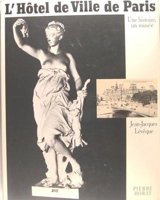 a black and white photo of a statue of a woman in a dress