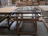 many tables and benches in a building with a lot of wood
