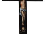 a wooden cross with a painting of jesus on it