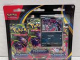 a close up of a package of pokemon cards on a white surface