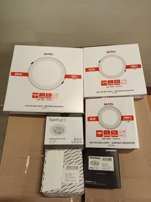 three boxes of electronic devices sitting on top of a cardboard box