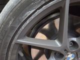 a close up of a tire on a car ' s rim