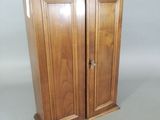an image of a wooden cabinet with two doors