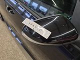 a close up of a car door handle with a sticker on it