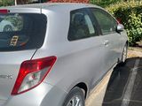 the rear end of a silver car parked in a parking lot