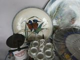 a lot of plates and cups on the table
