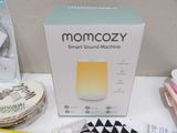 a box with a smart sound machine sitting on a table
