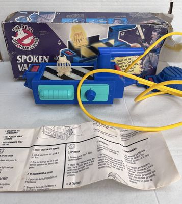 a small blue toy truck with a yellow cord attached to it