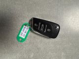 a car key with a tag attached to it