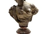 bronze bust of a woman on a marble pedestal on a white background