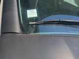 a close up of a car windshield with a sticker on it
