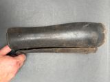 someone is holding a piece of leather that has been placed on top of it