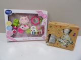 two toys in the box on the table next to each other