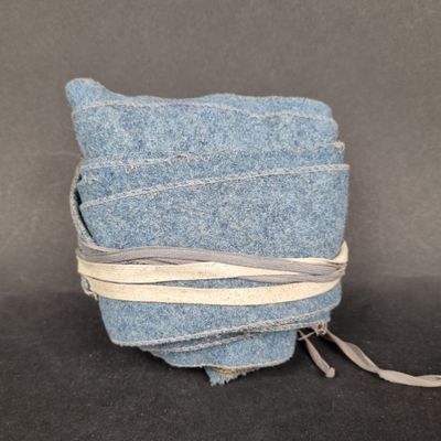 a stack of blue blankets wrapped around each other