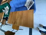 a blue couch and a wooden table in a room