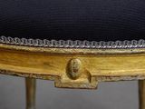 an image of a close up of a chair with a black cushion