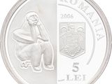 a picture of a silver coin with a picture of a man sitting on a toilet