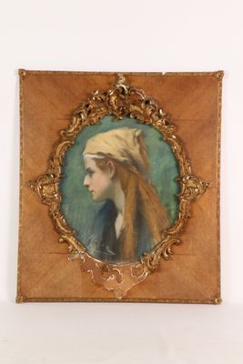 an old picture of a woman with a turban on her head