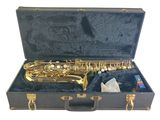 a saxophone in a black case with gold hardware