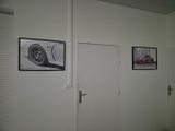 pictures on the wall above the doors of a room
