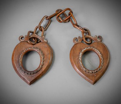 a pair of antique wooden heart shaped key chains