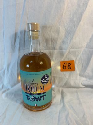 a bottle of rum in front of a white background